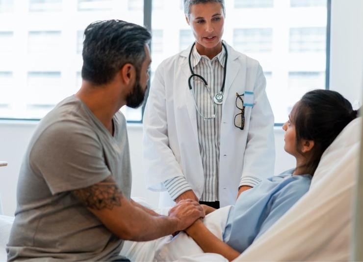 Doctor and couple talk