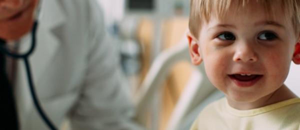 Doctor examining pediatric patient
